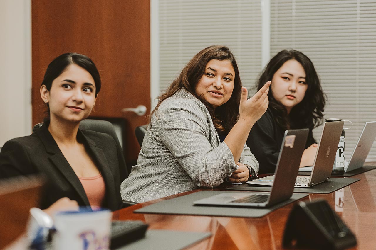Students discussing a project in a meeting room